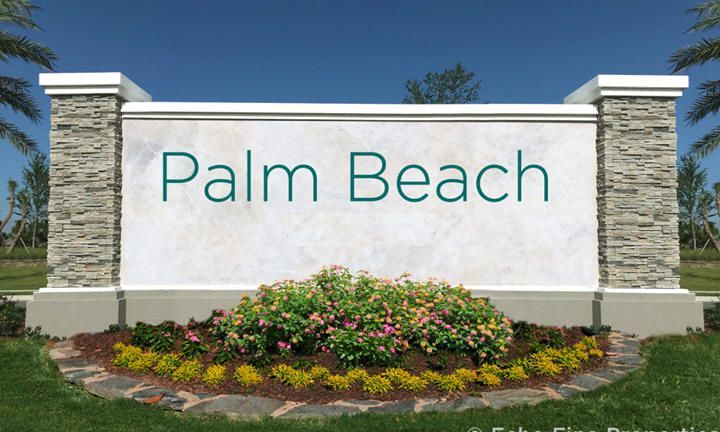 A palm beach sign is surrounded by flowers and palm trees