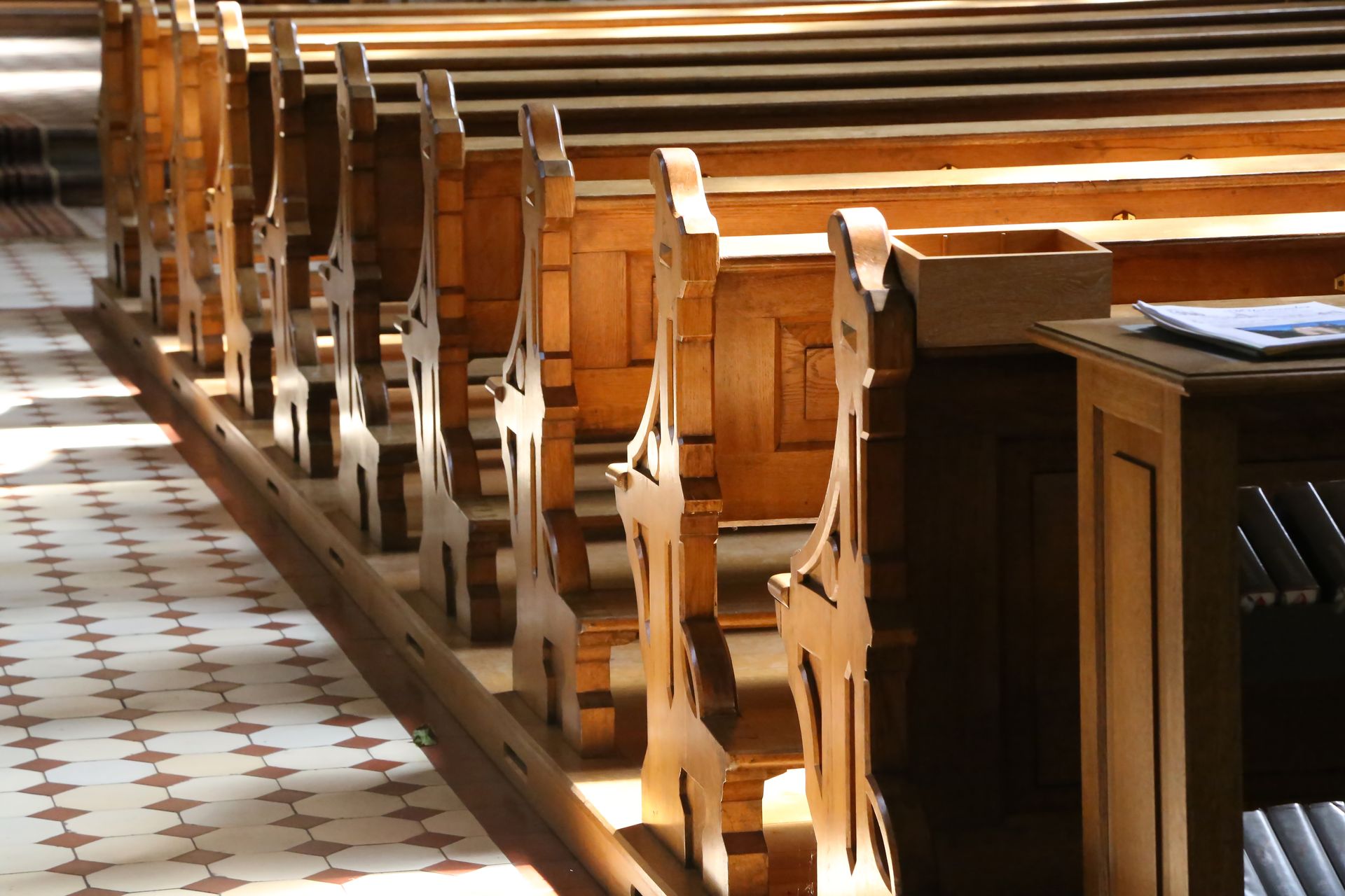 A row of wooden benches in a church